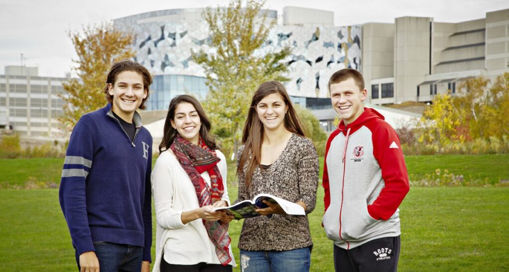 Students stand on campus