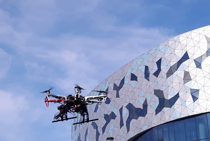 drone flies near bergeron building