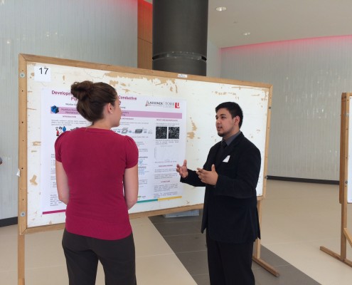 people talk in front of research filled whiteboard