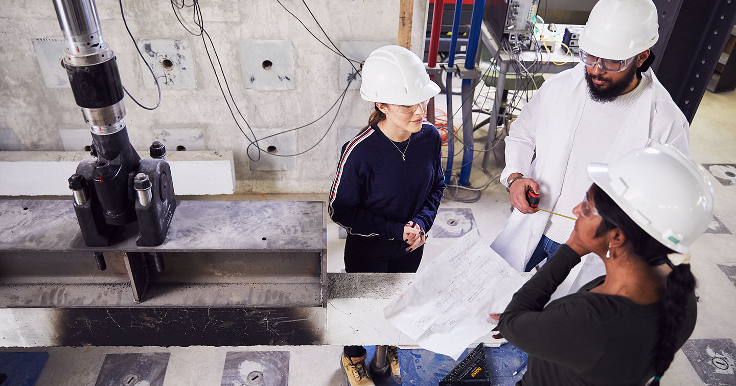 Researchers working in high bay lab