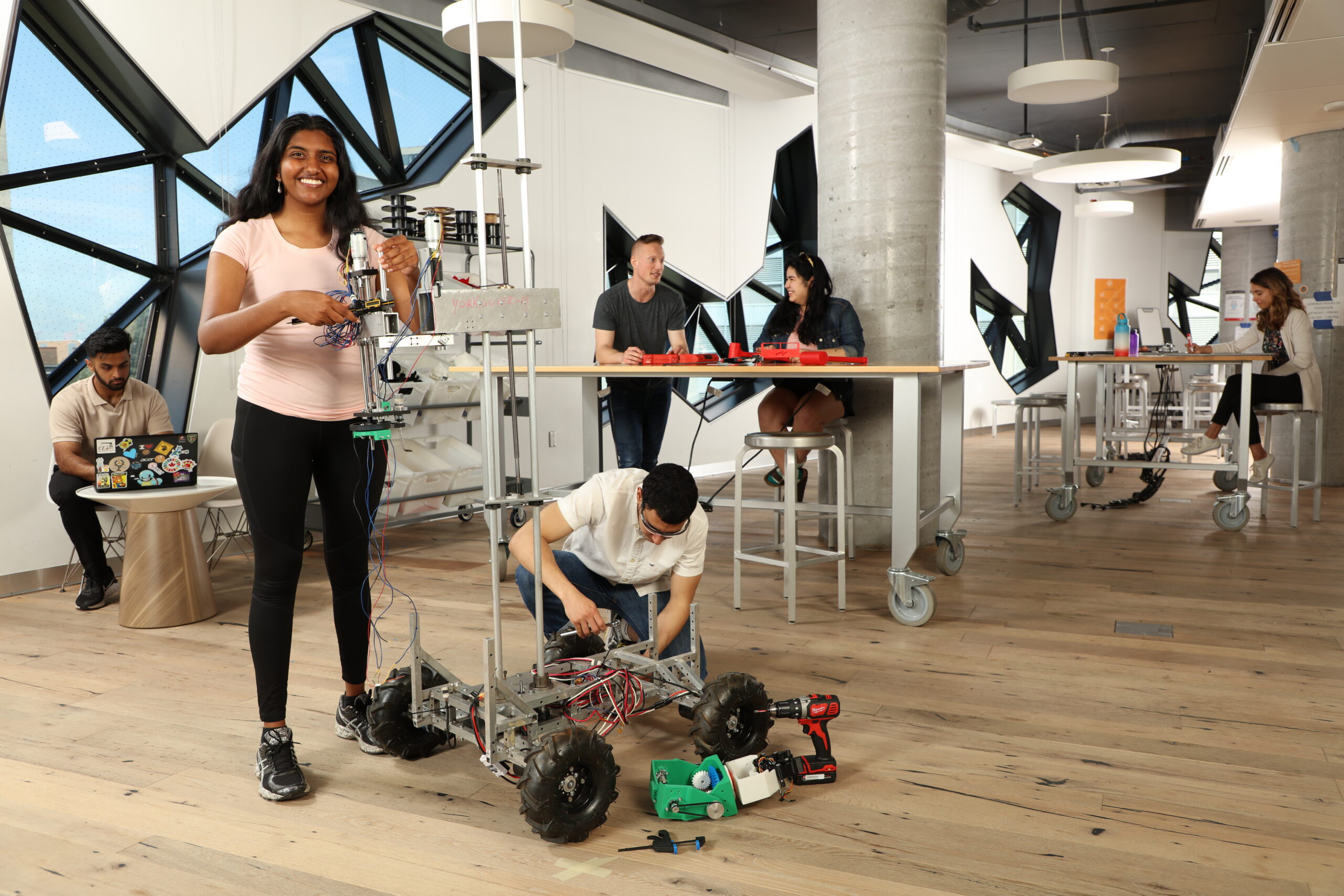 students from Lassonde Robotics team tinkering with the Mars Rover