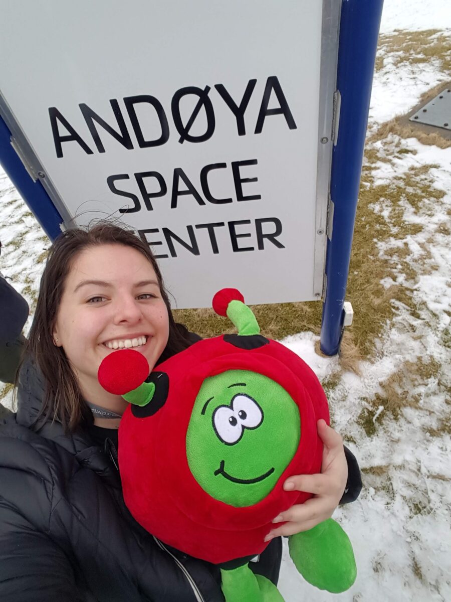 Megan Gran at Andøya Space Centre sign with a plush toy