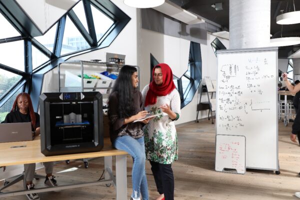 Lassonde 2023 LURA Competition Now Open (news article featured image), two female students discussing research project at a school lab