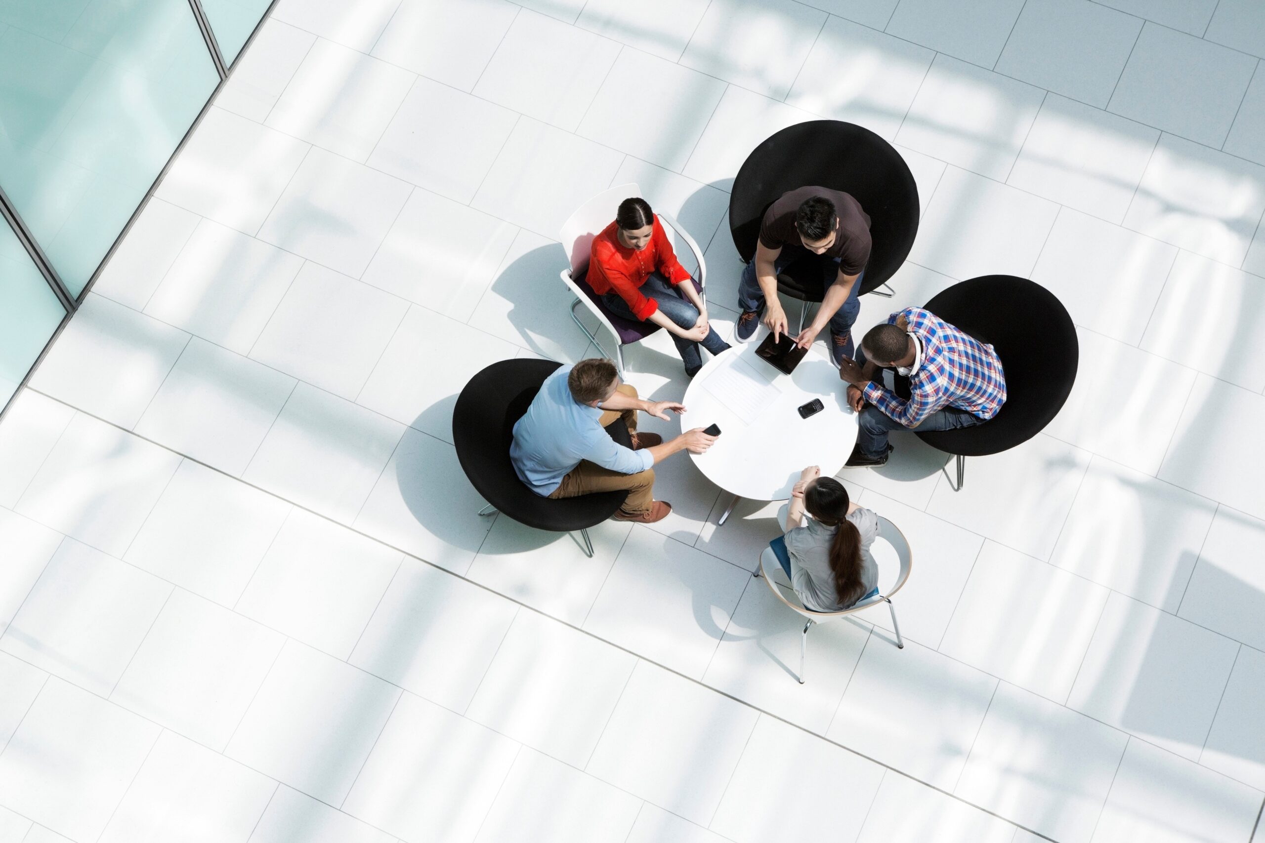 top view, business team of four at a round table