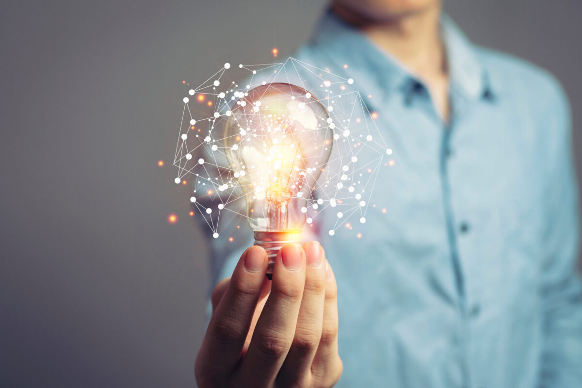 image of a person holding a lightbulb, a symbol of creativity and new ideas