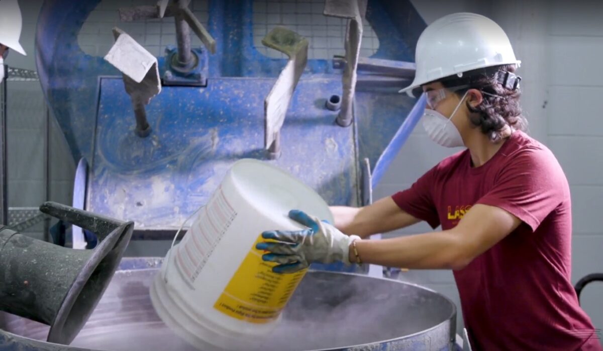 Austin Martins-Robalino preparing a fiber-reinforced concrete mixture.