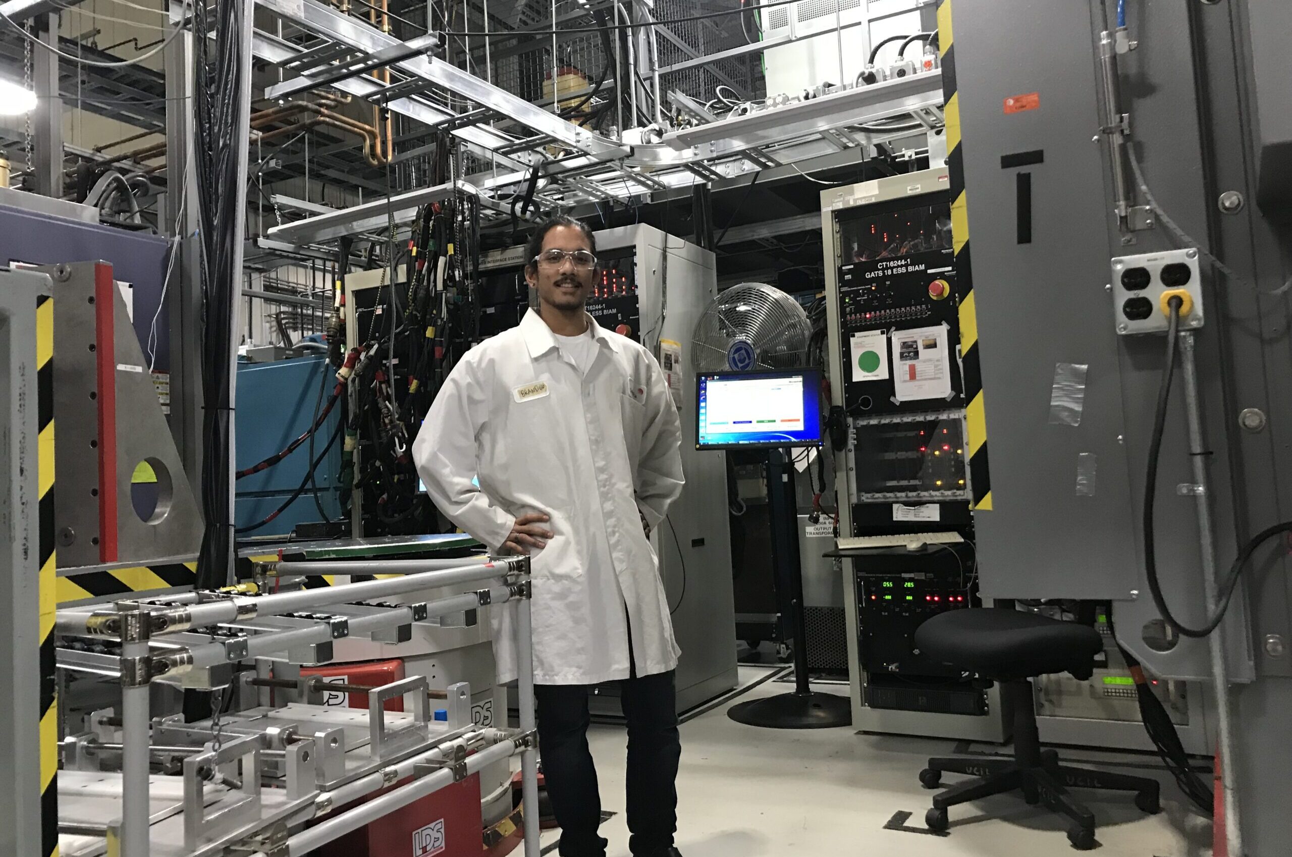 Brandon Loy standing in laboratory