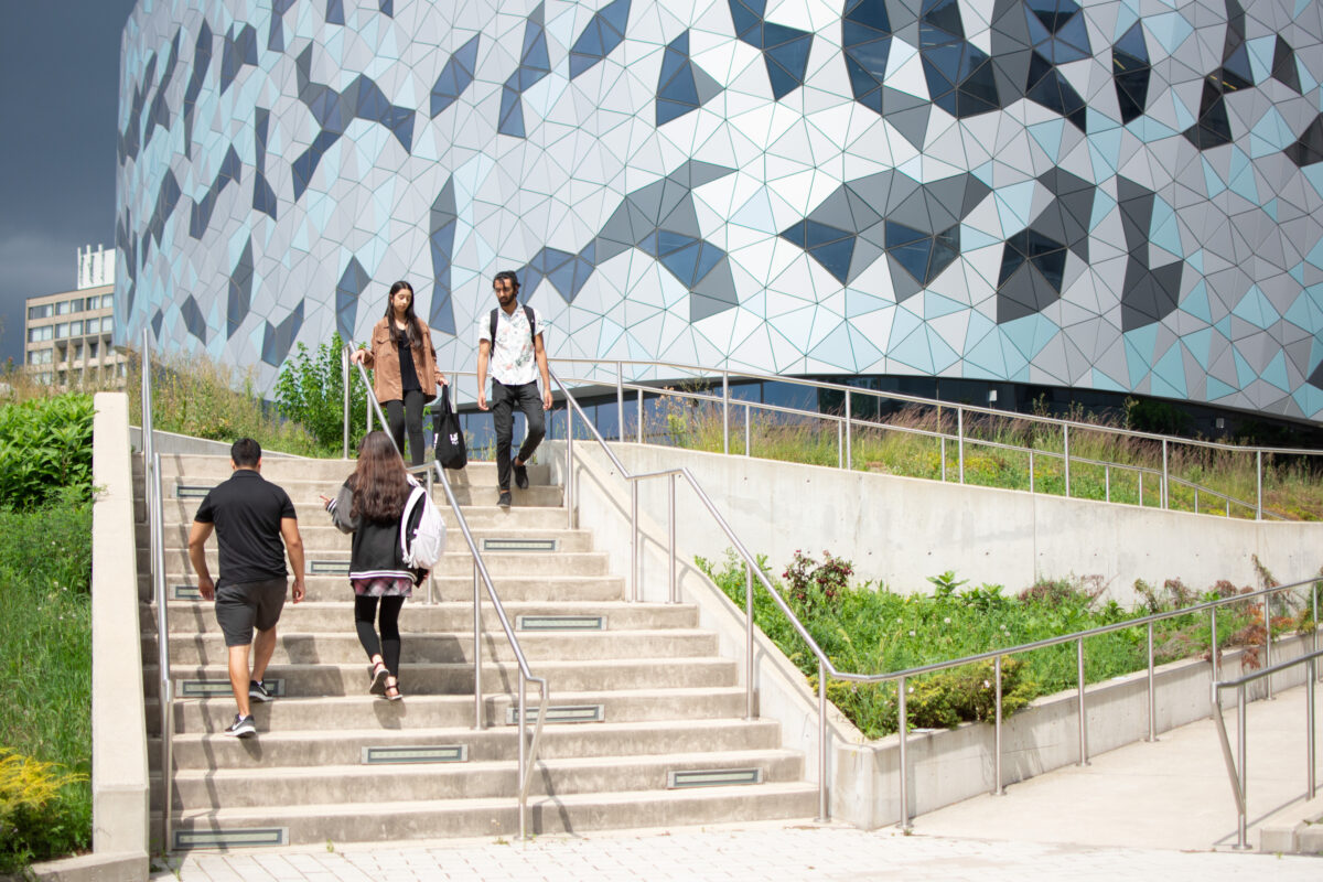 students walking on stairs outsider bergeron center