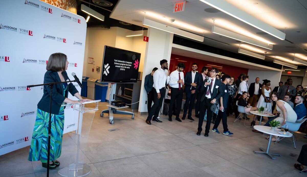 Dean Goodyer addressing guests and graduates at the convocation reception. 