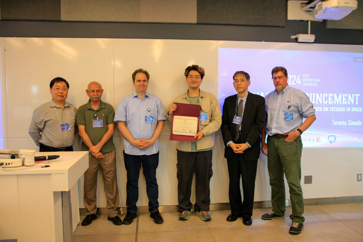 Fuzhen Yao with Professor George Zhu and judges at the International Conference on Tethers in Space