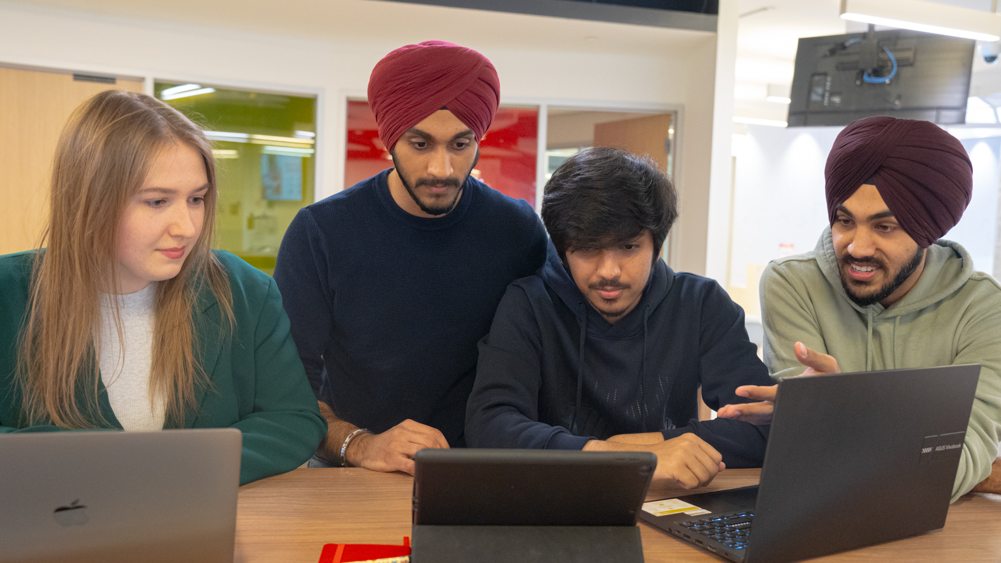 Four undergraduate students working together.