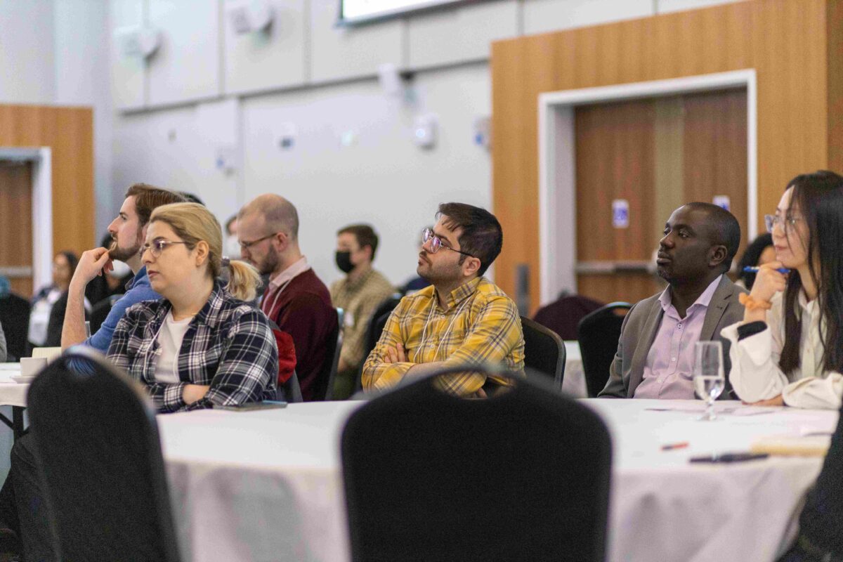 Attendees listening to speakers at One WATER’s World Water Day Celebration