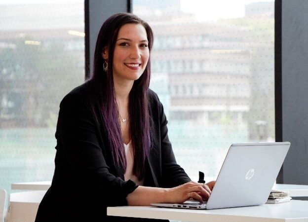 Josephine writing machine learning code at her laptop in the Bergeron Centre.