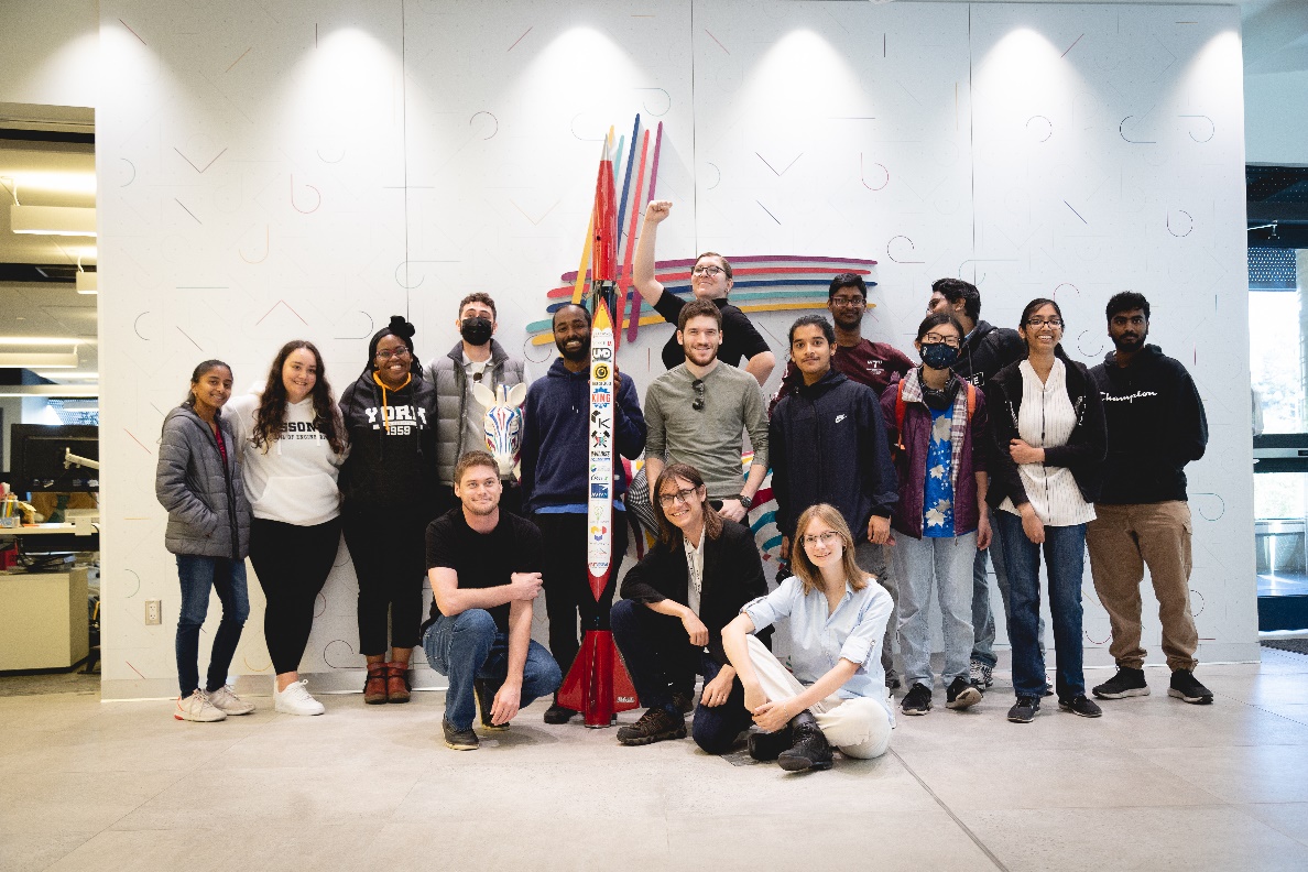 Members of team Arbalest Rocketry posing with the Goose 2 rocket along with other Lassonde School of Engineering community members