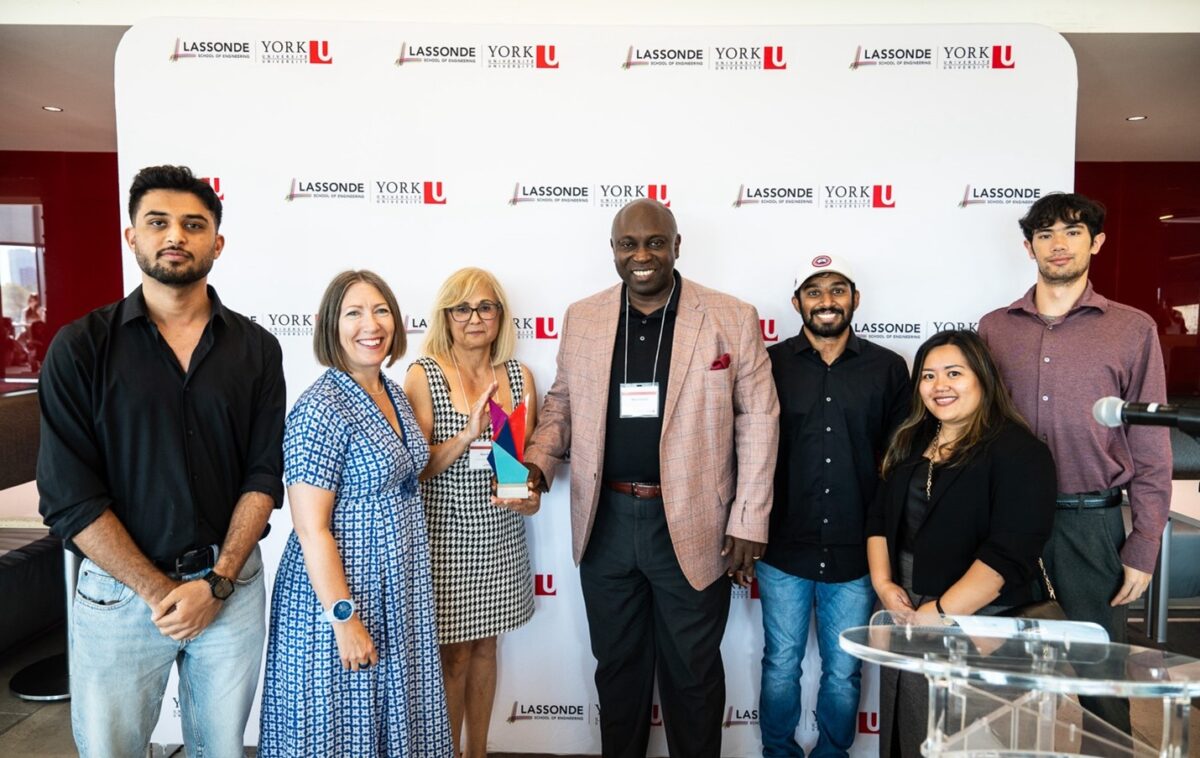 Representatives from CYSSC I & IT Cluster, a division of MCCSS, Alex Coleman and Rose Russo accepting their Co-op Employer of the Year award from Dean Jane Goodyer and Mayolyn Dagsi, accompanied by former CYSSC co-op students. Lassonde Awards Ceremony.