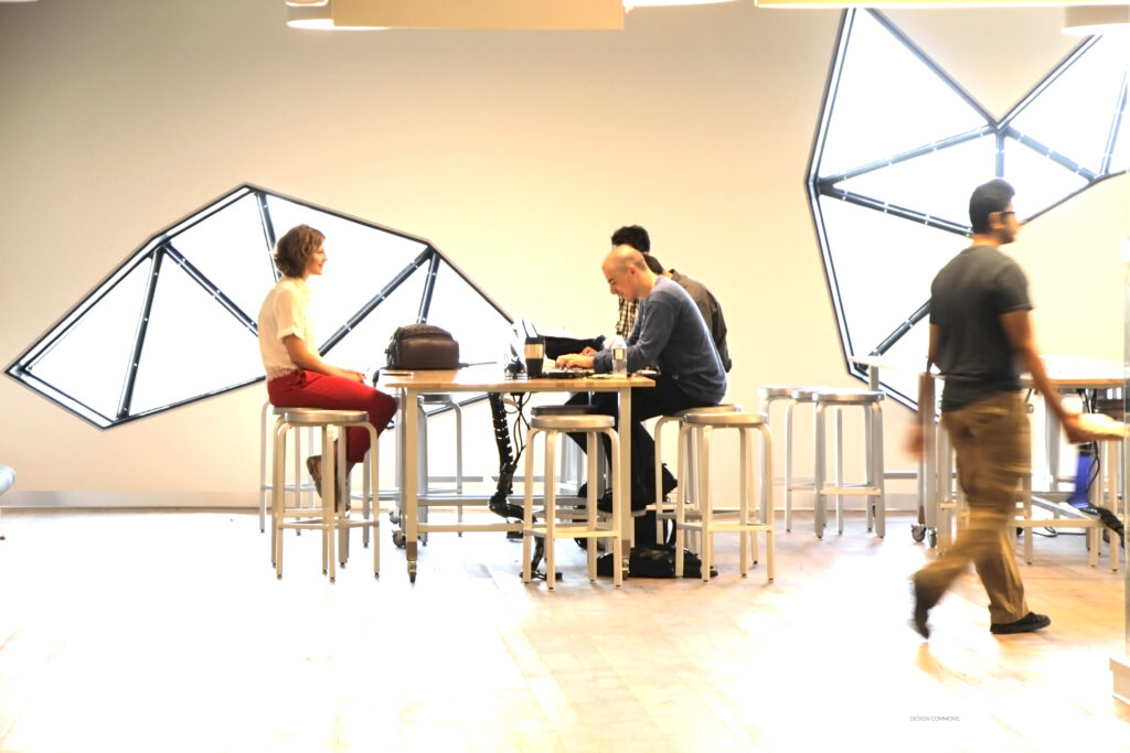 Students sitting at a table in the Bergeron Centre at the Lassonde school of engineering at york university