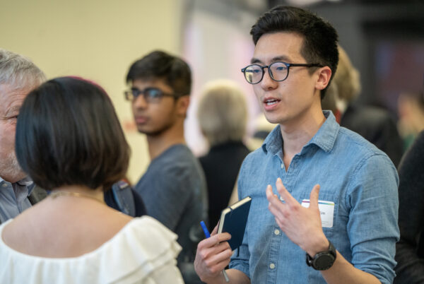 student talks to Eva Lau