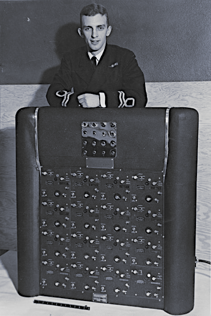 Lt. James Belyea standing behind one of his computerized inventions (circa late 1940s or early 1950s)