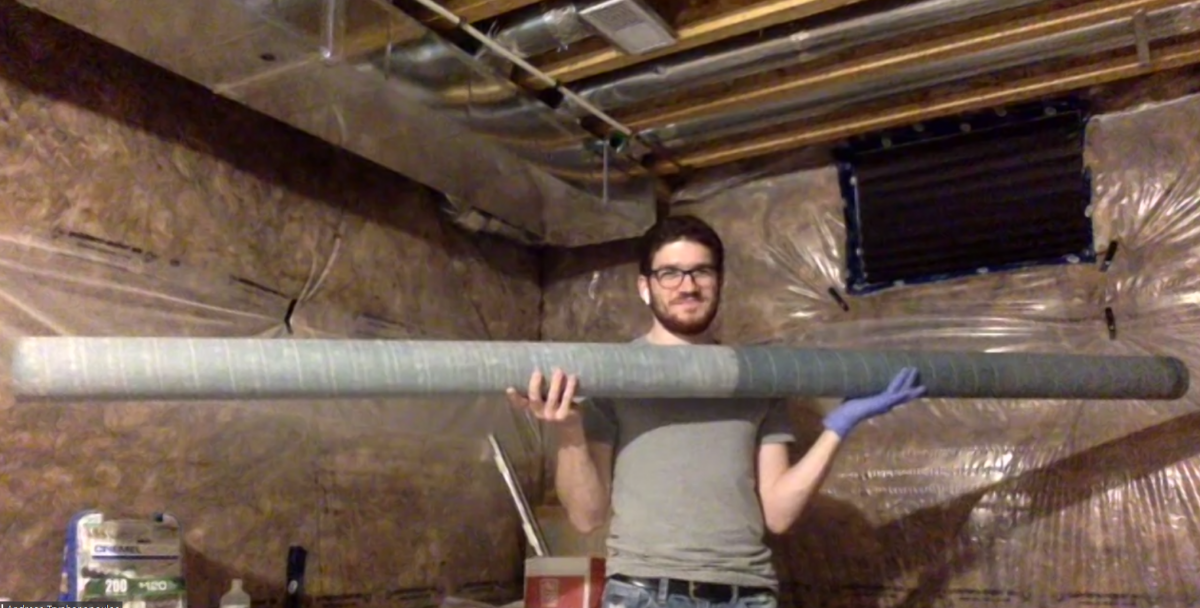 Andreas holds large tube