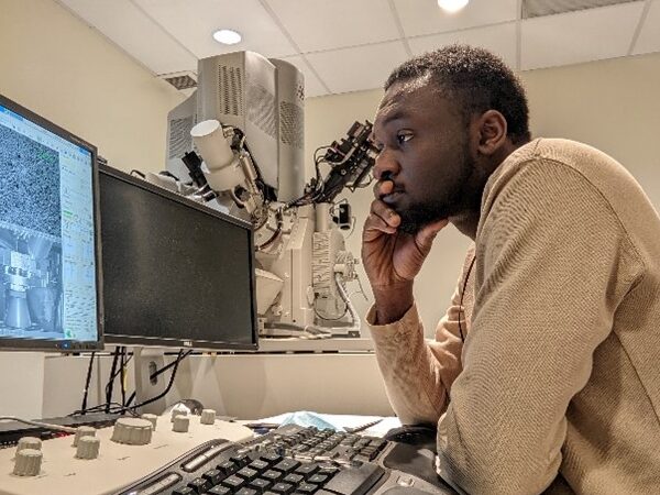 Agyapong studying the microstructure of a specimen on a scanning electron microscopy