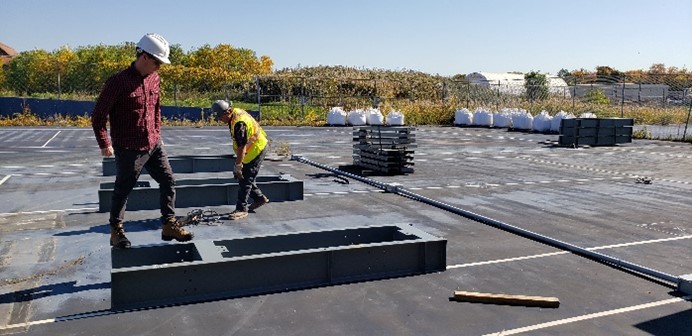 Professor Liam Butler helping install test frames at the CD3 Facility for Built Infrastructure.