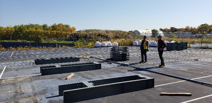 Professor Liam Butler helping install test frames at the CD3 Facility for Built Infrastructure.