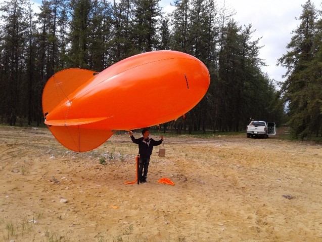 Professor Gordon’s graduate student, Timothy Jiang, preparing to launch a tethered balloon in the Boreal Forest of northern Alberta to measure pollutants released from oil sands and production facilities.