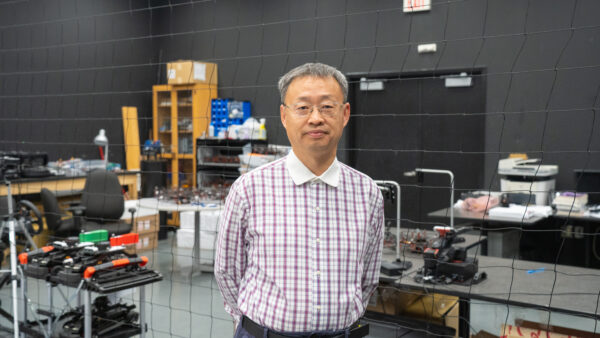 Professor Jinjun Shan standing in his laboratory