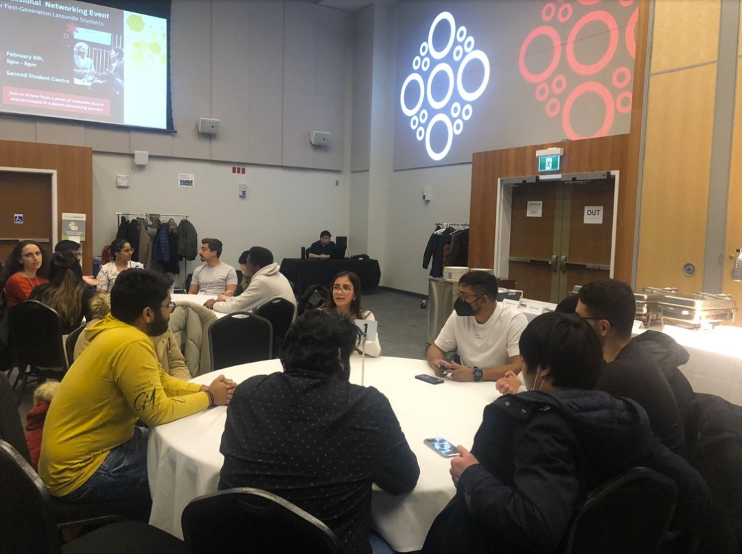 First-generation students engage with alumni at a speed networking session.