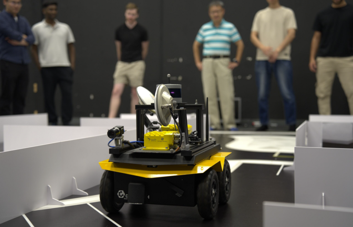 Professor Jinjun Shan and his students overseeing an autonomous vehicle in motion 