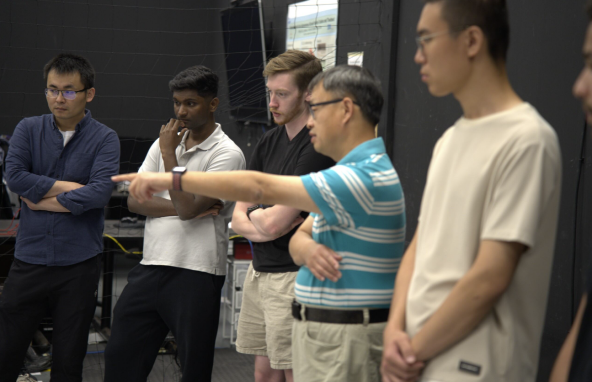 Professor Jinjun Shan collaborating with his students.