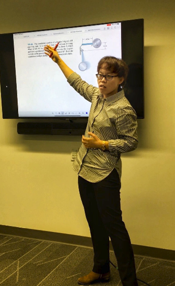 Professor Cuiying Jian giving a lecture in her Dynamics course.