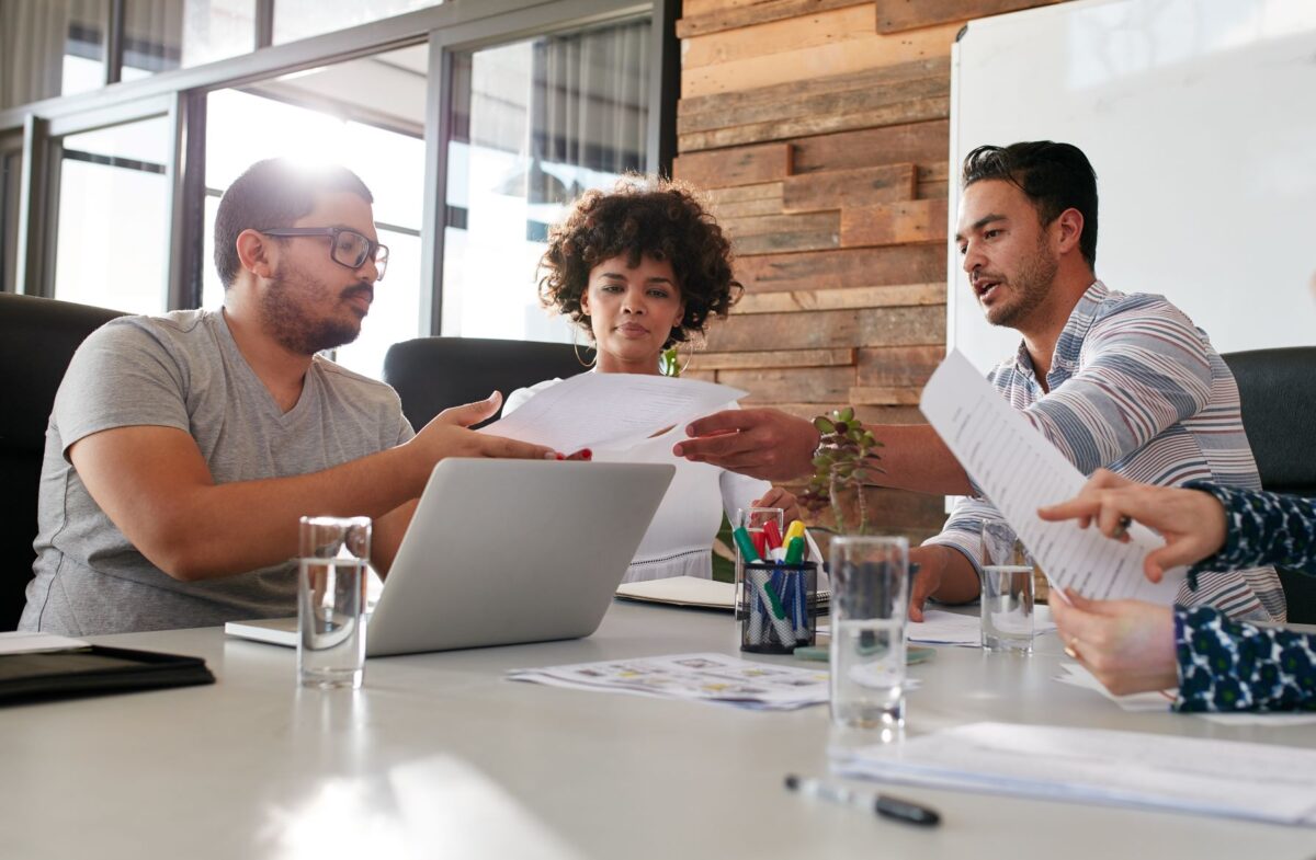 Three young workers in an office