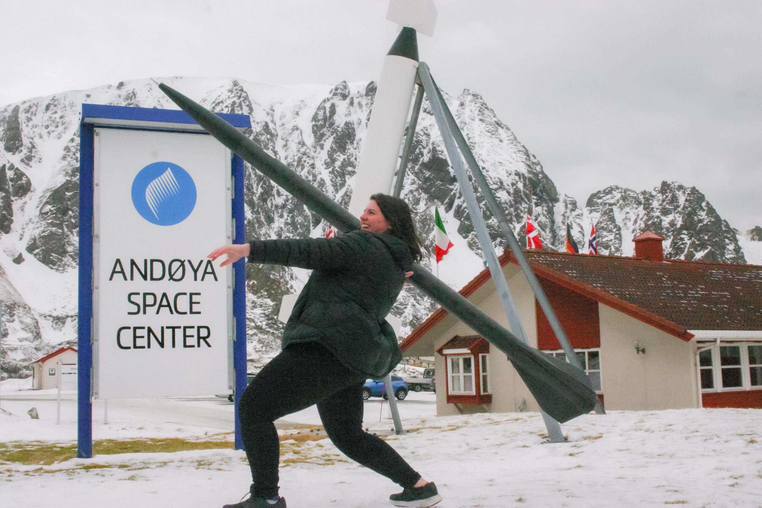 Megan Gran pretending to throw a rocket at Andoya Space Center