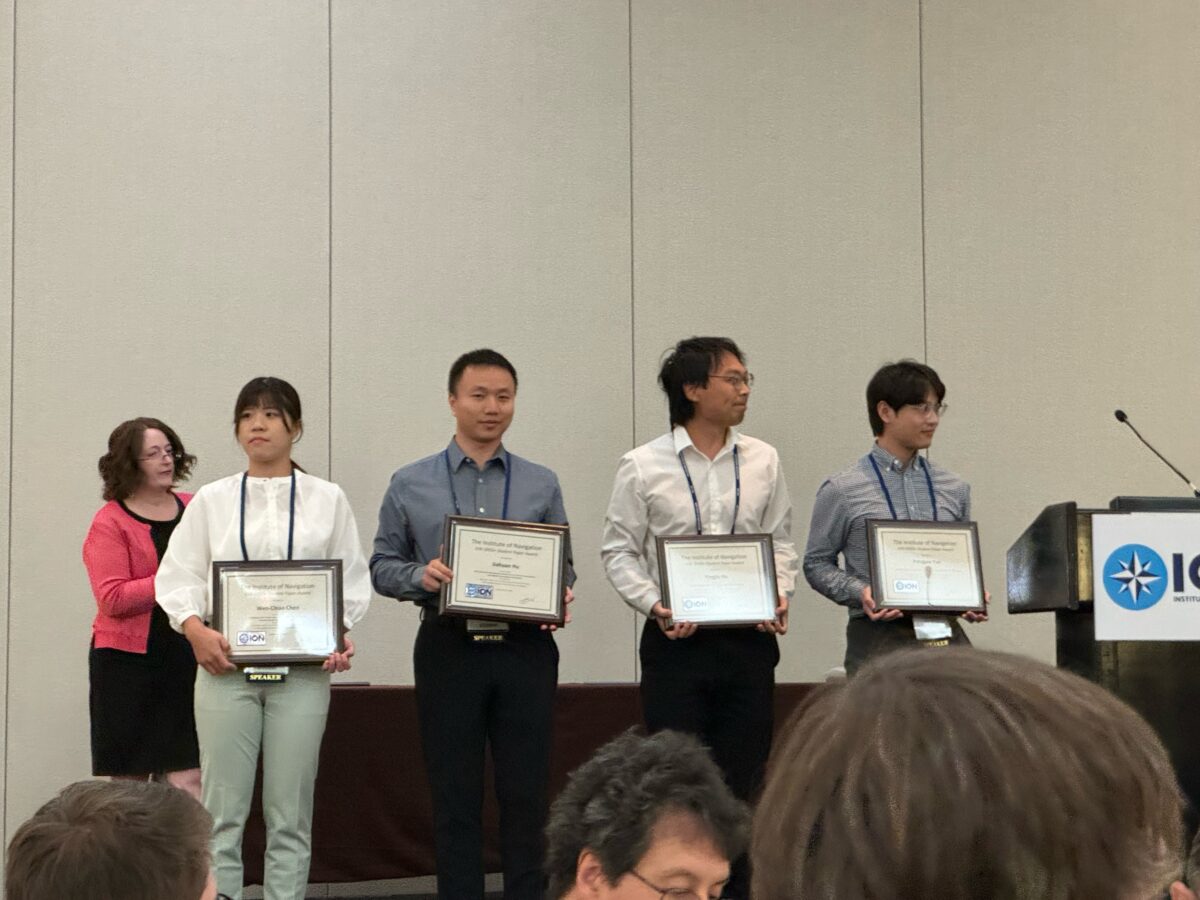 Jiahuan Hu (second from left) receiving his Best Student Paper award.