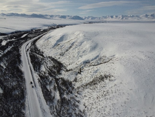 Aerial view facing south of a field site with buried glacial ice. The Dempster Highway was the route taken to Tombstone Territorial Park each day.