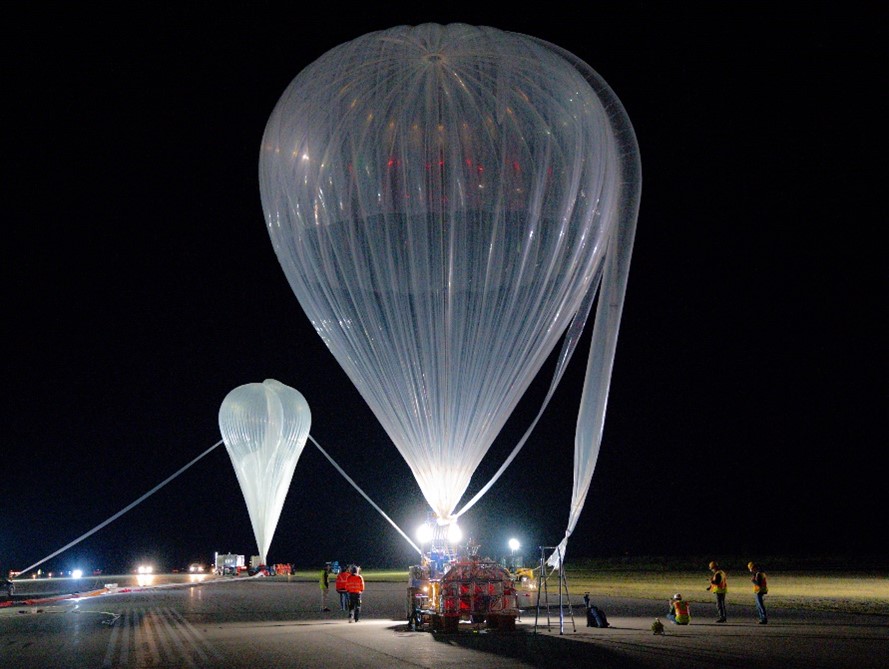 High-altitude balloons preparing for launch at Timmins Stratospheric Balloon Base, part of Strato-Science campaign.