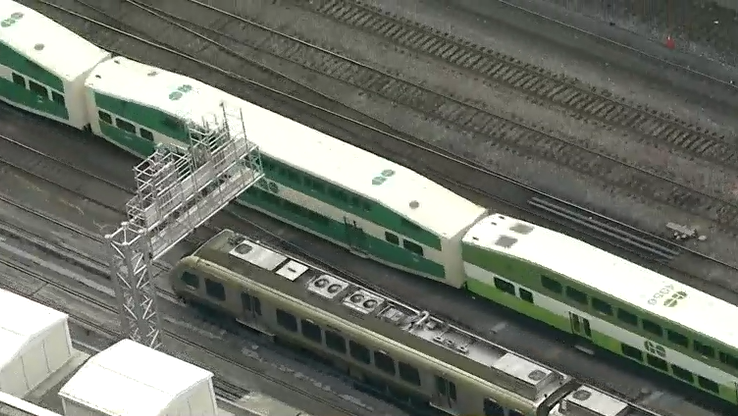 UP express train passing a GO train on the railways