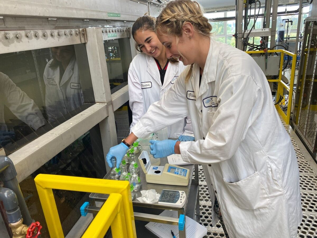 experiential workshop at the Walkerton Clean Water Centre (WCWC), two female students performing water test