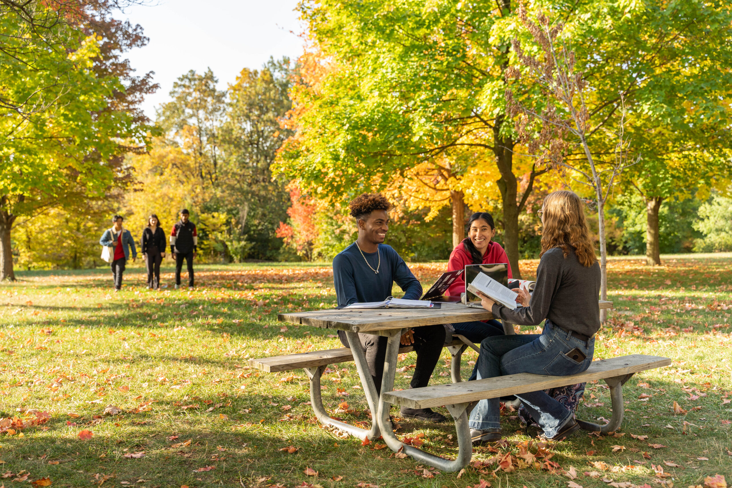 arboretum students sitting on the bench