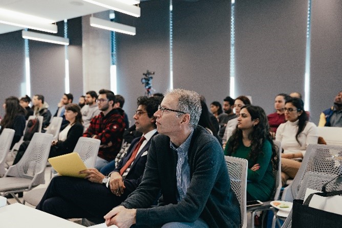 Attendees listening to Dr. John McCartney at the Distinguished Speaker Series