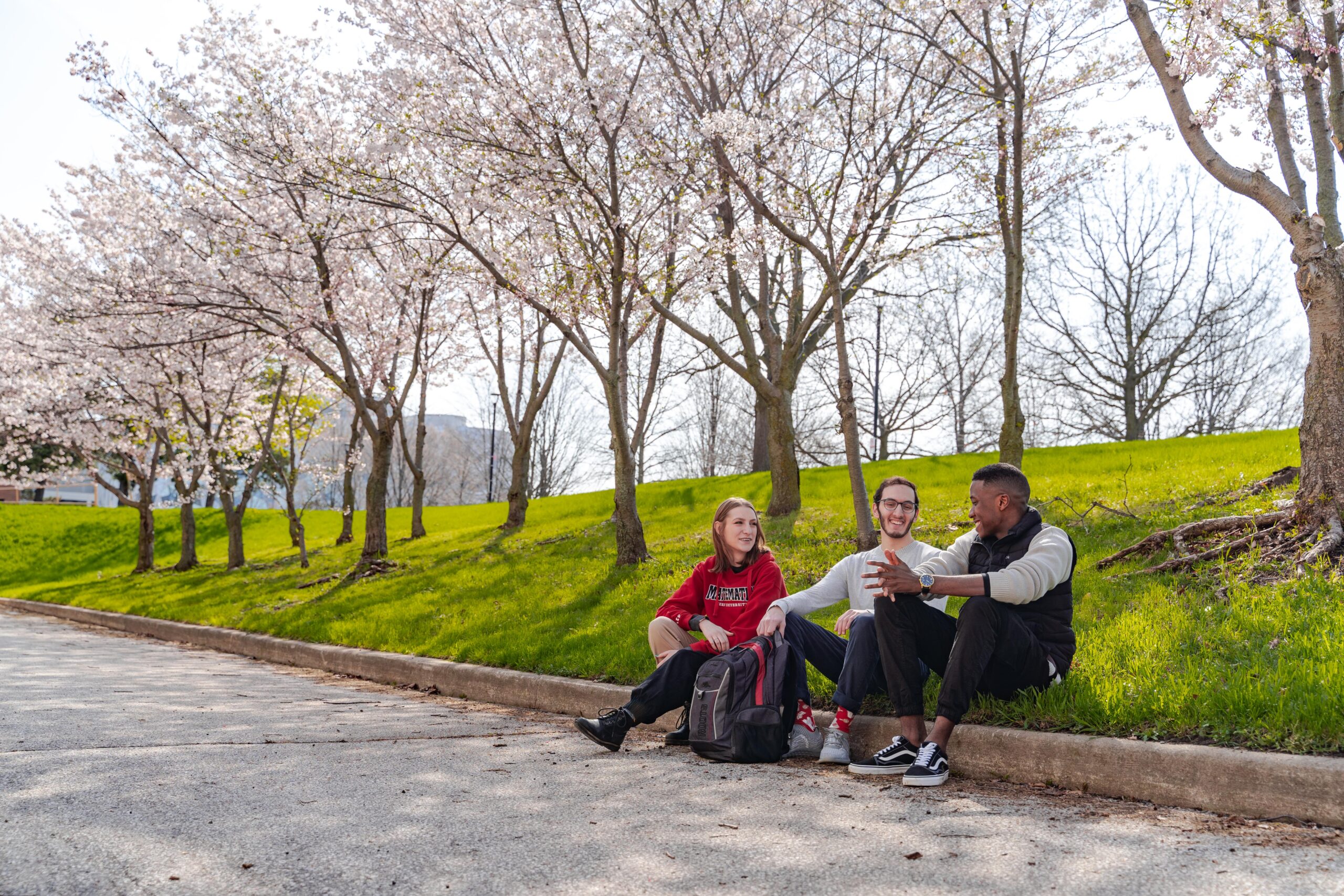 York students chatting outdoors, spring time