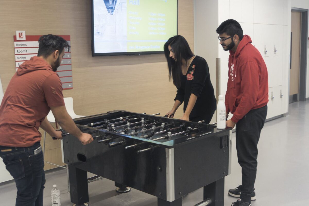 lassonde students playing table foosball