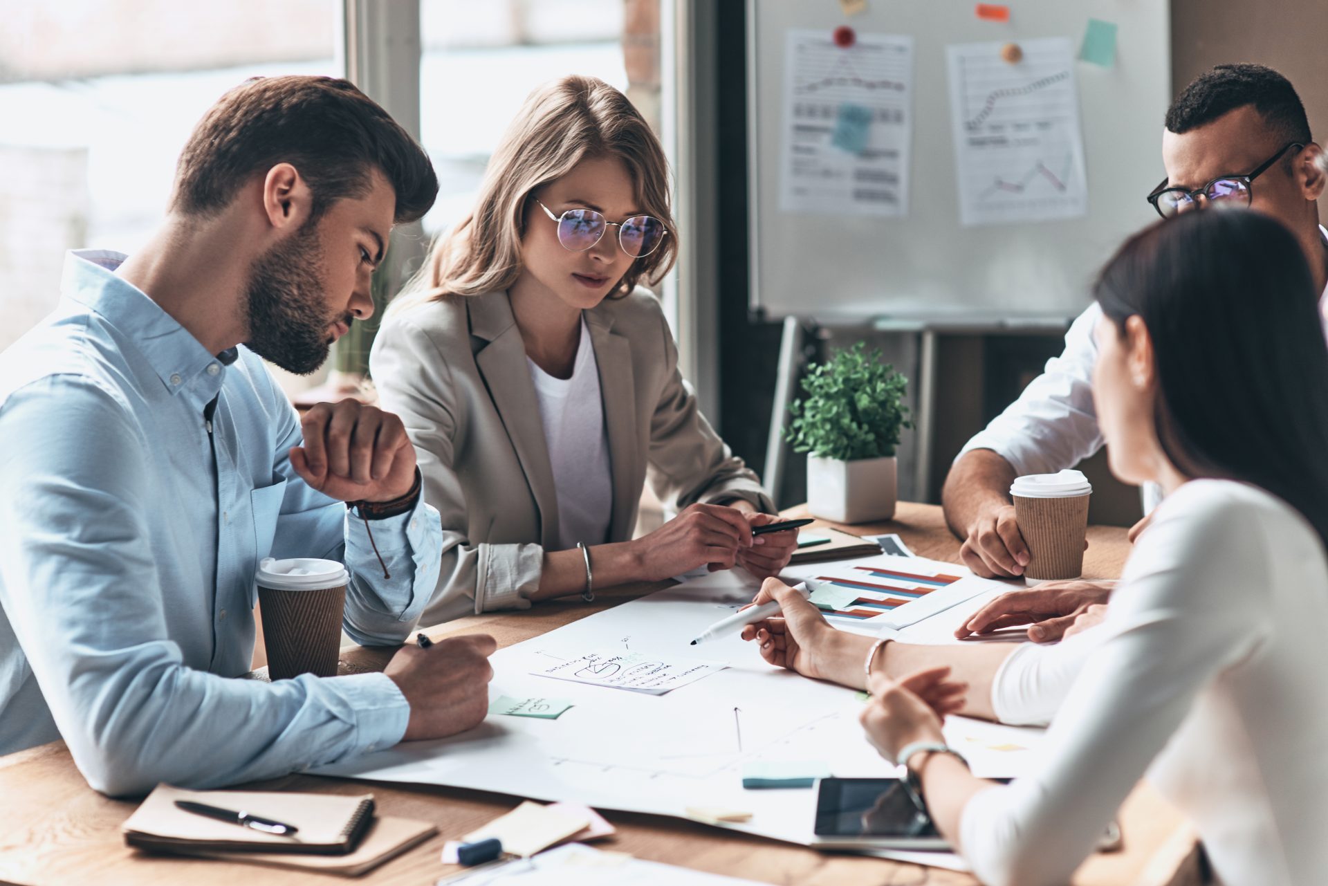 Group of people working around a desk