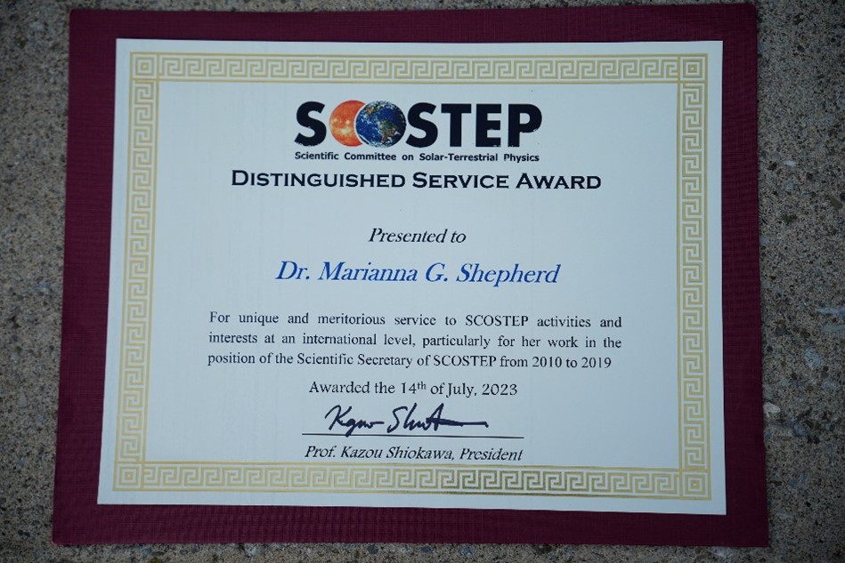 Dr. Marianna Shepherd’s SCOSTEP Distinguished Service Award.