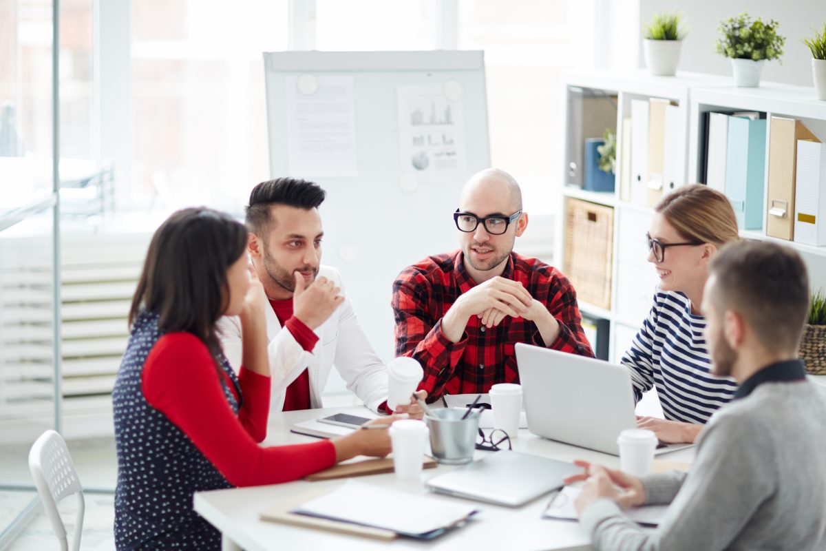 Group having a meeting around a table