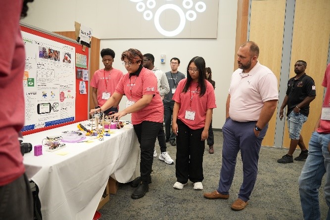 Team 2 presenting their research project at Bringing STEM to Life Symposium