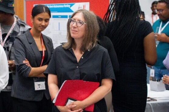 Lassonde Dean Jane Goodyer listening to presentations at the Bringing STEM to Life symposium. 