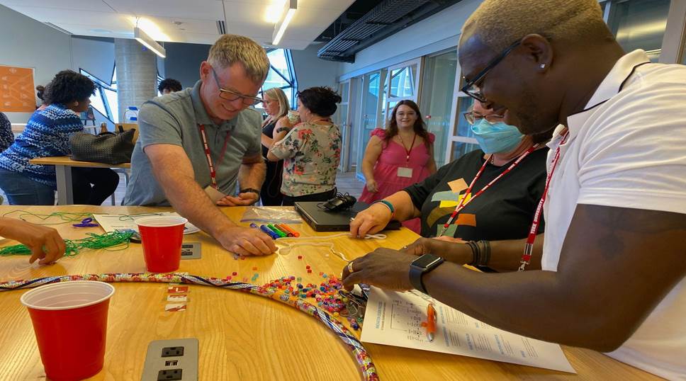 teachers enjoying collaboration activity at k2i STEM workshop