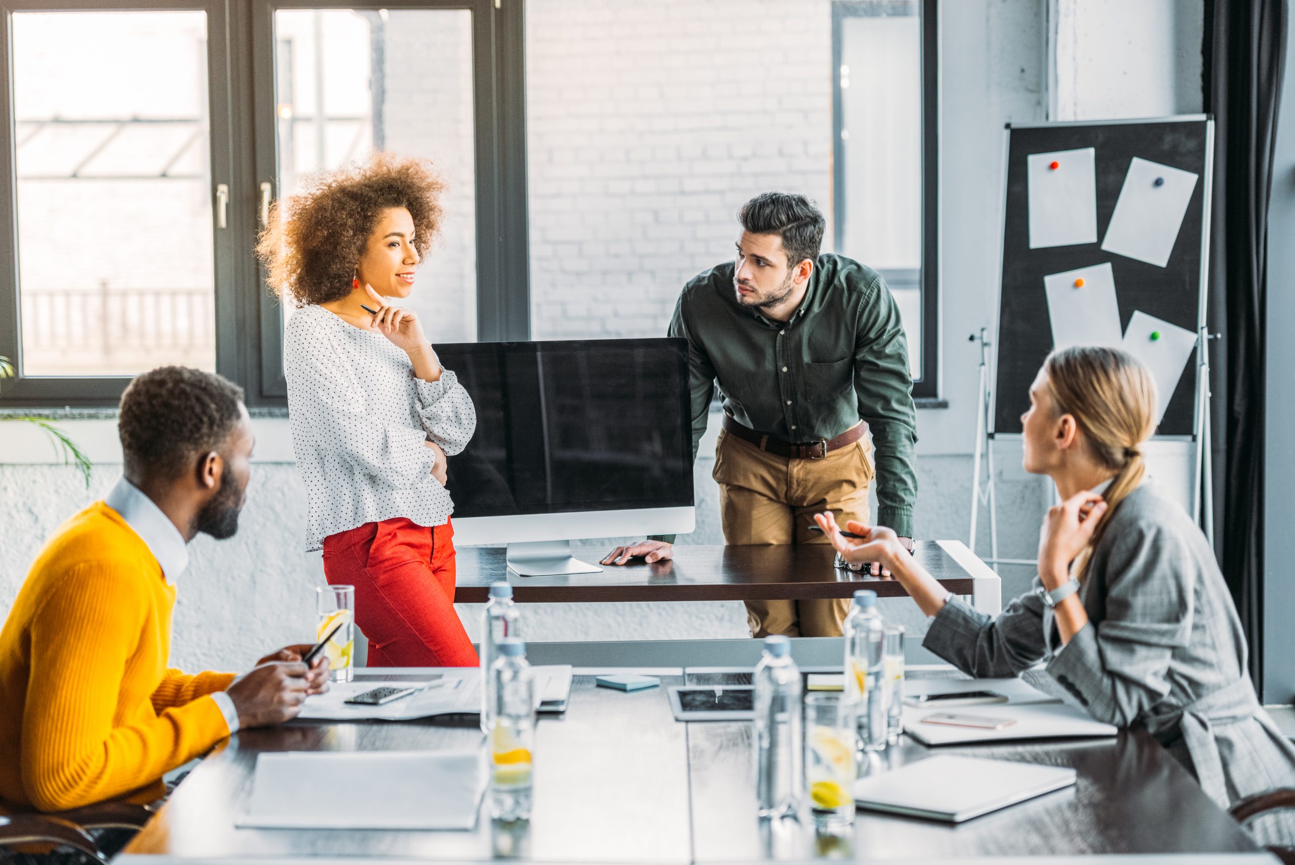 Group of four people in a meeting